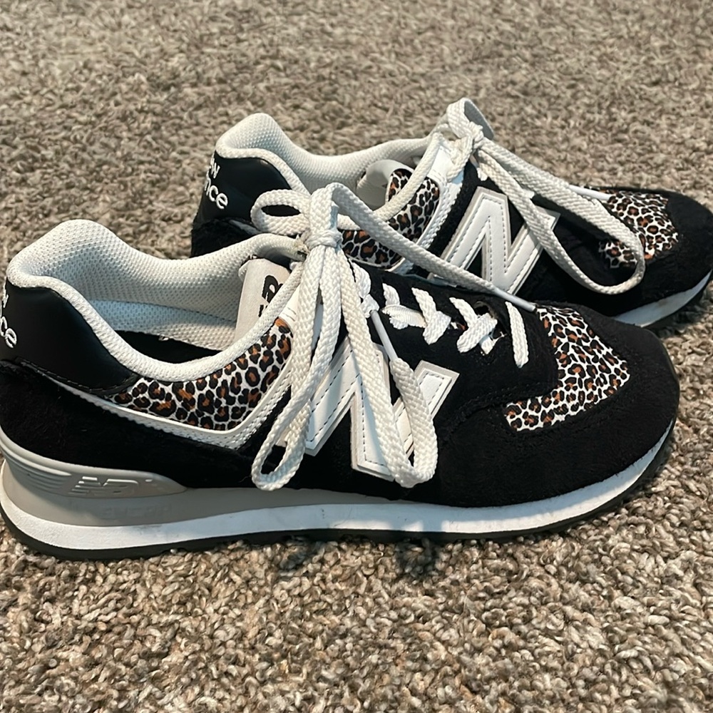 Women’s size 8, New Balance, cheetah print, 574.
